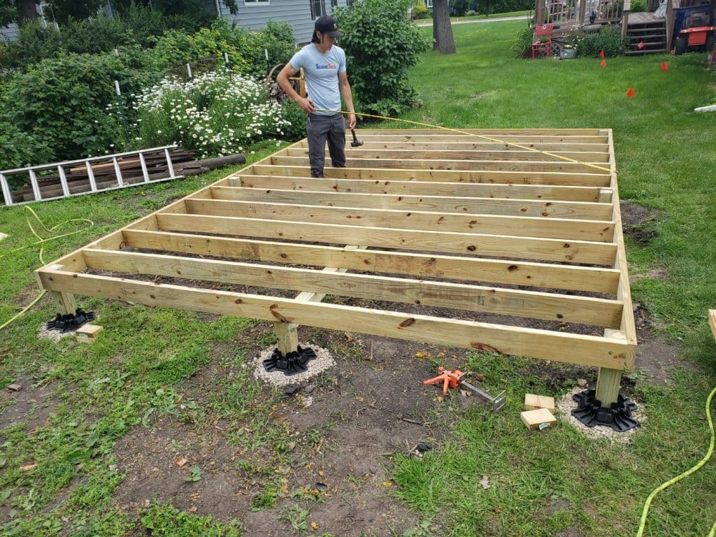 Leveling wood shed base